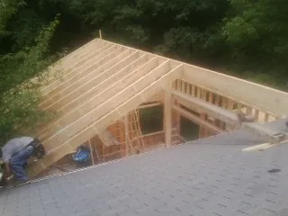 Framing a new roof addition that ties into an existing shingle roof in Cambridge
